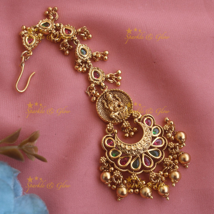 Beautiful Lakshmi half moon jadau maang tikka with red beads