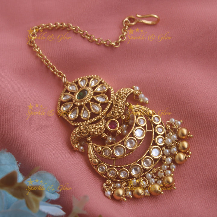 Grand Floral moon kundan maang tikka with green beads
