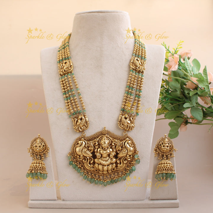 Exquisite Lakshmi peacock carved haram with multi layer beads chain - mint green and gold