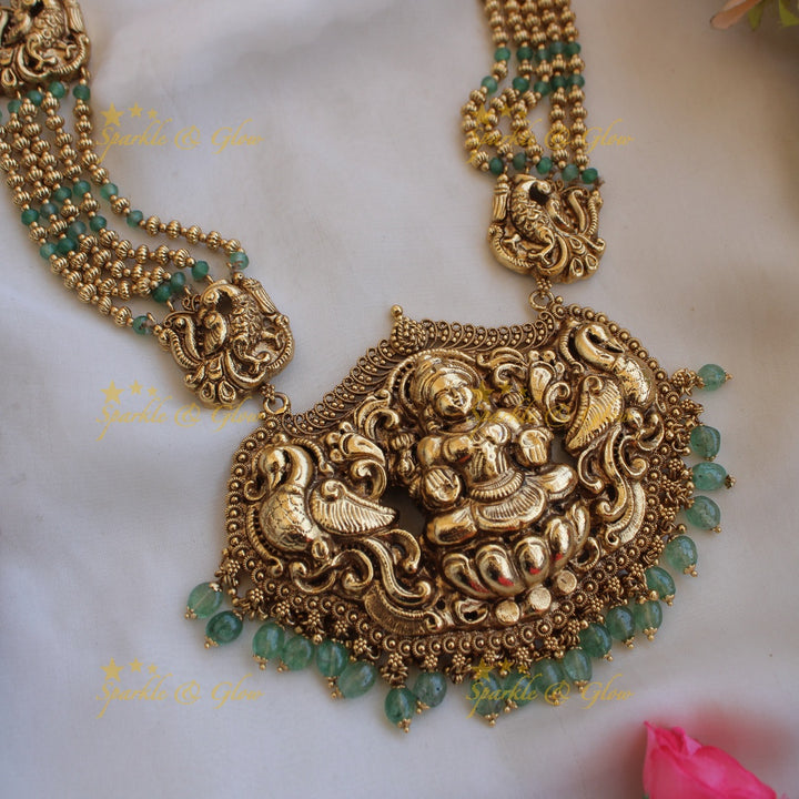 Exquisite Lakshmi peacock carved haram with multi layer beads chain - mint green and gold