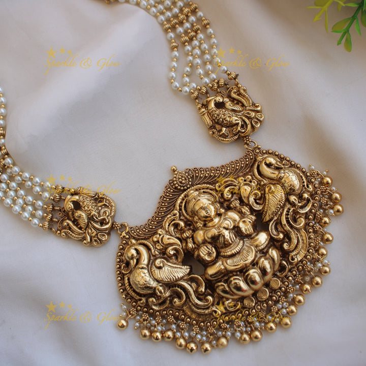 Exquisite Lakshmi peacock carved haram with multi layer beads chain - pearl and gold