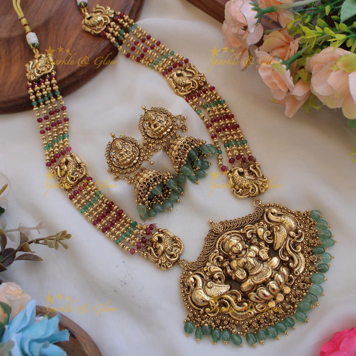 Exquisite Lakshmi peacock carved haram with multi layer beads chain - multi colour beads