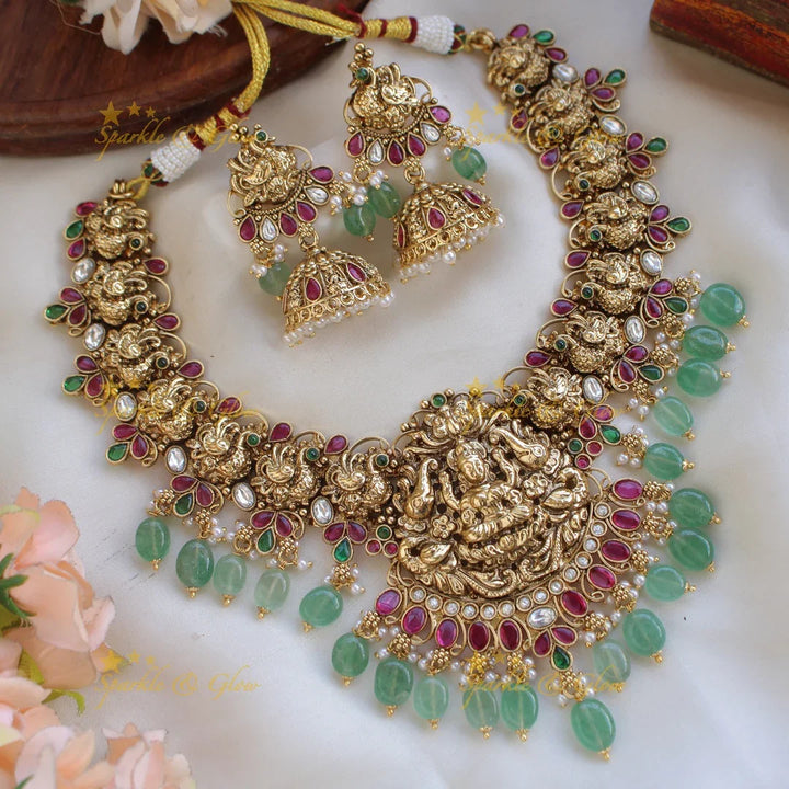Stunning Lakshmi elephant and peacock carved short necklace with mint green beads and stones - white - Sparkle and Glow