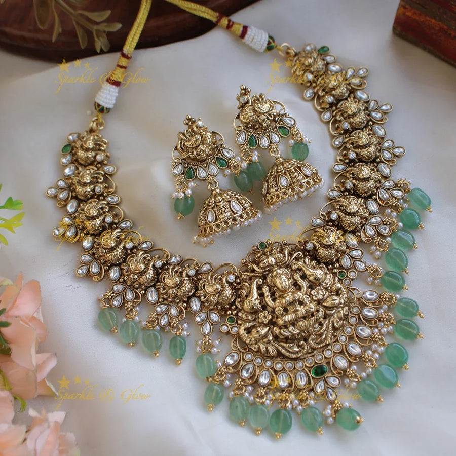 Stunning Lakshmi elephant and peacock carved short necklace with mint green beads and stones - white - Sparkle and Glow