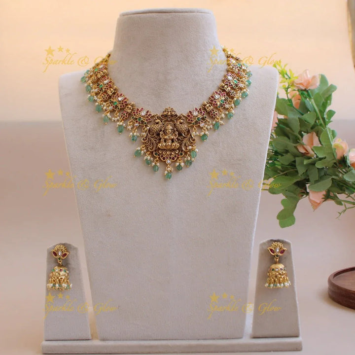 Elegant Lakshmi Lotus design kemp stone short necklace with pearls and mint green beads - Sparkle and Glow