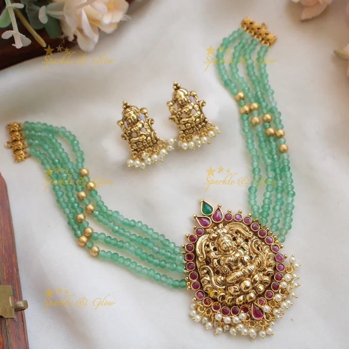 Elegant Lakshmi carved choker with multi layer beads ruby and pearls - maroon - Sparkle and Glow