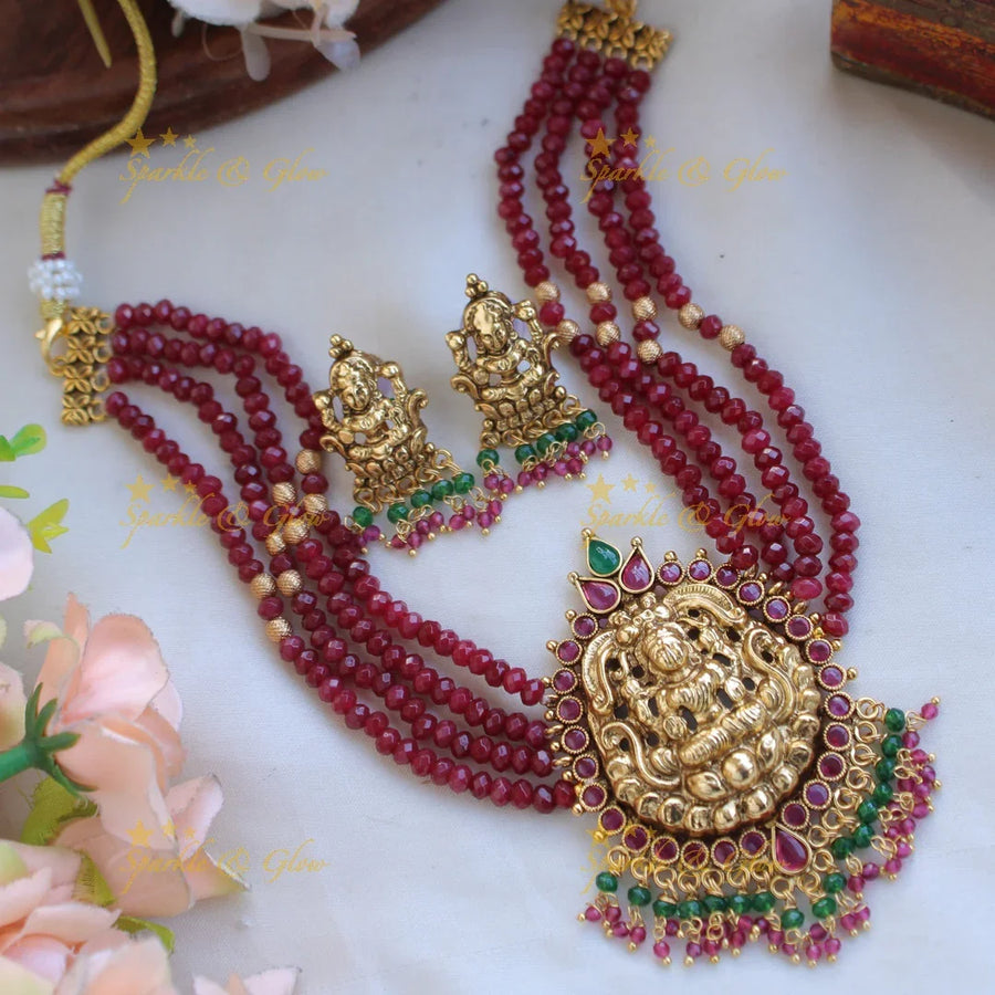 Elegant Lakshmi carved choker with multi layer beads ruby and pearls - maroon - Sparkle and Glow