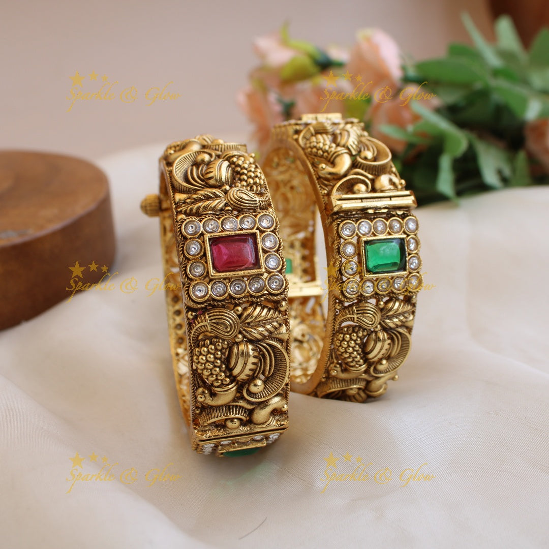 Stunning Peacock carved bangles with ruby emerald and white stones a pair