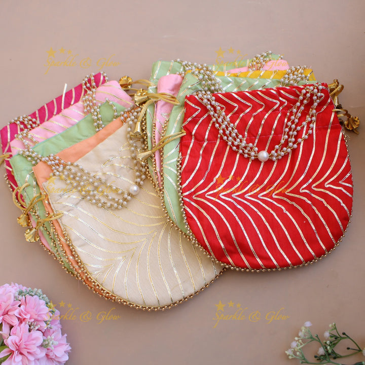 Golden work 8.5*8 inch potli bags with gold beads and pearls