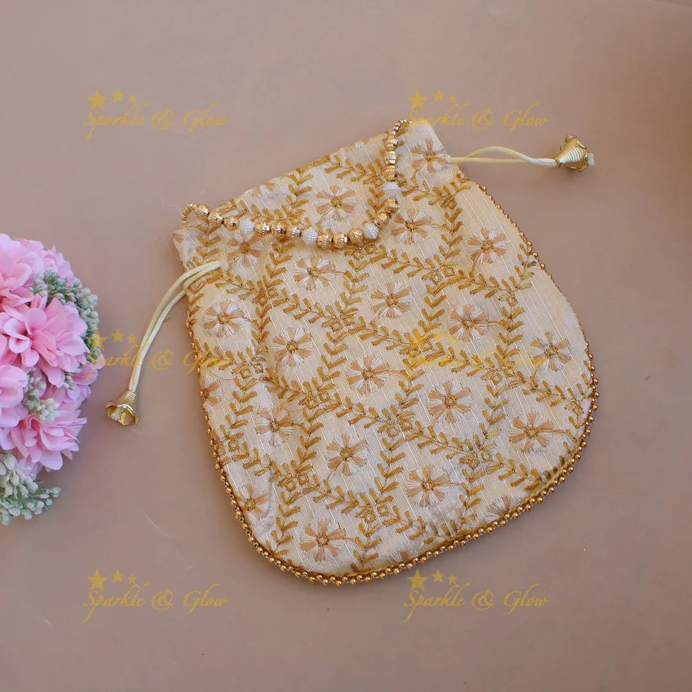 Floral design different colour Embroidered 8.5*8 inch potli bags with pearls and gold beads - Sparkle and Glow