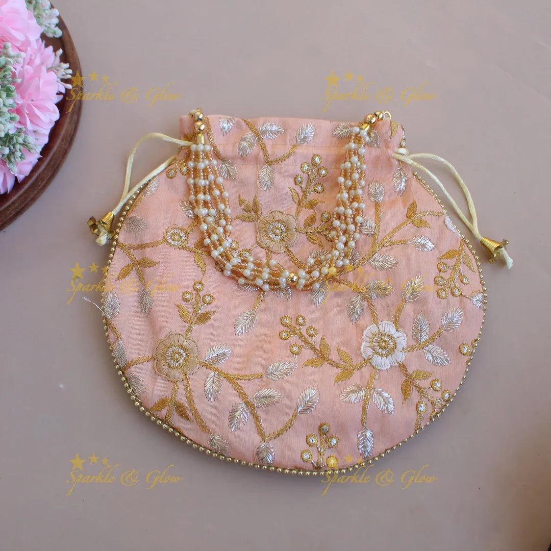 Floral Embroidered pot shape 8.5*8 inch potli bags with gold beads and pearl handle - Sparkle and Glow