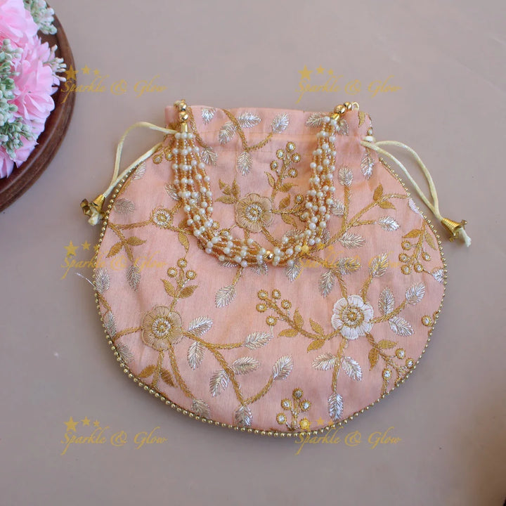 Floral Embroidered pot shape 8.5*8 inch potli bags with gold beads and pearl handle - Sparkle and Glow