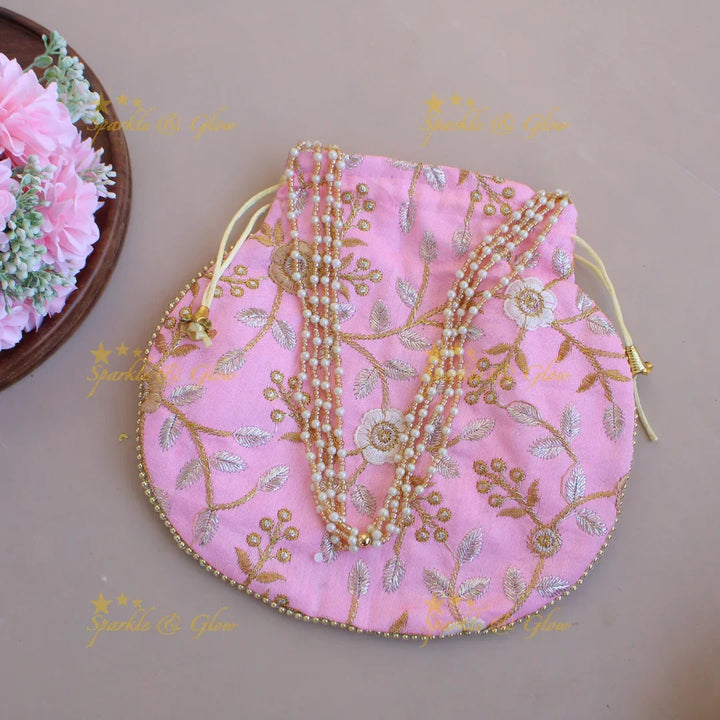 Floral Embroidered pot shape 8.5*8 inch potli bags with gold beads and pearl handle - Sparkle and Glow