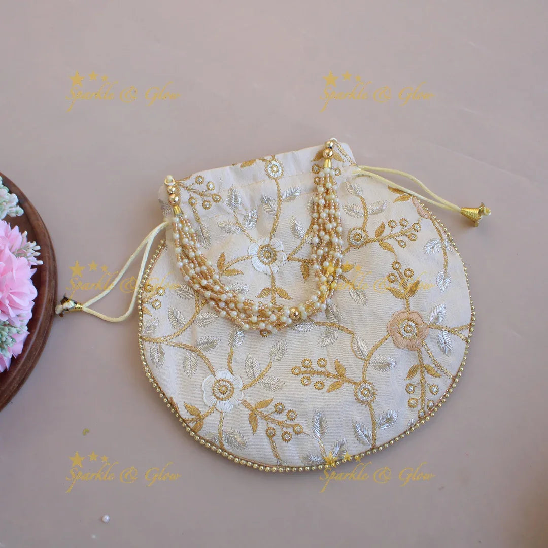 Floral Embroidered pot shape 8.5*8 inch potli bags with gold beads and pearl handle - Sparkle and Glow