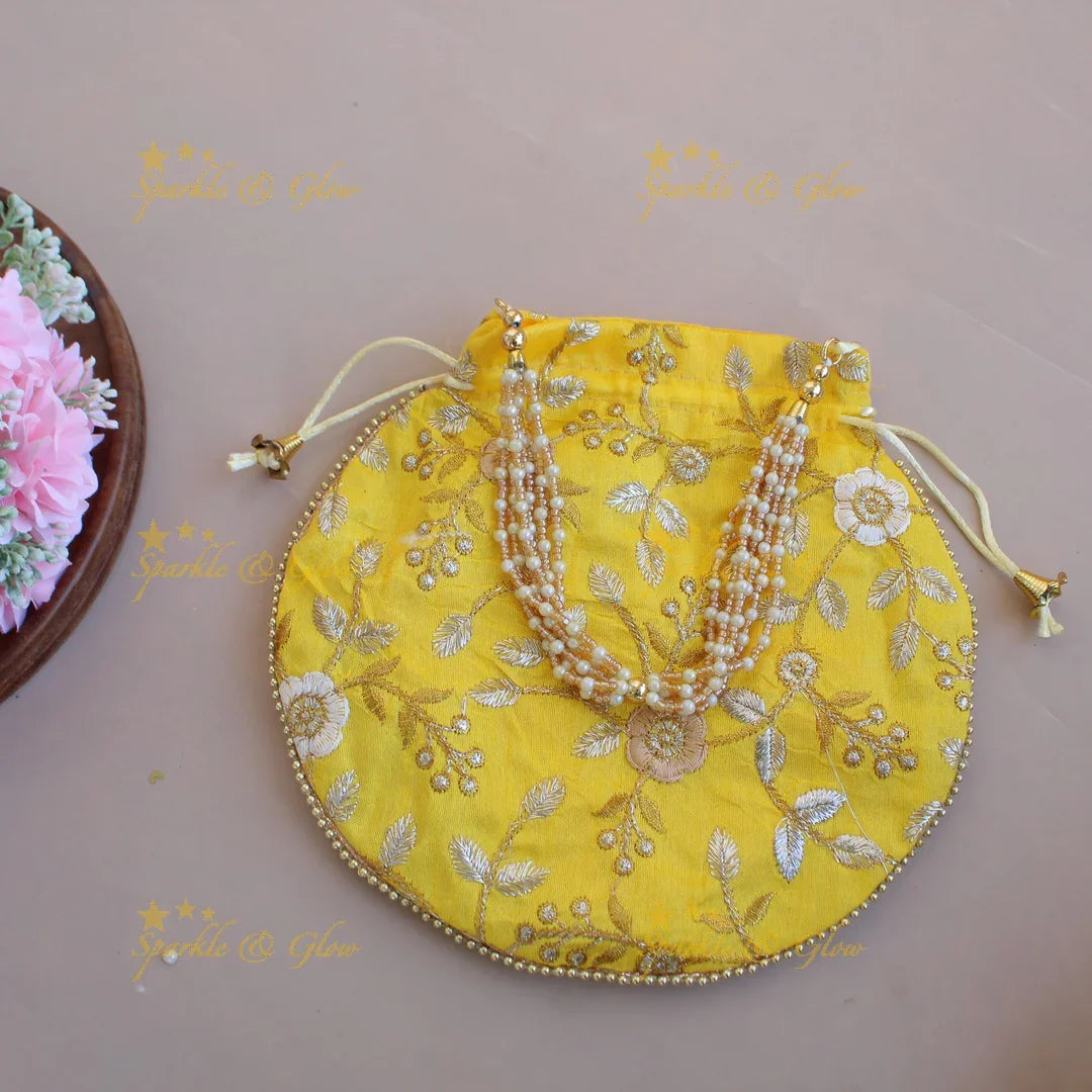 Floral Embroidered pot shape 8.5*8 inch potli bags with gold beads and pearl handle - Sparkle and Glow