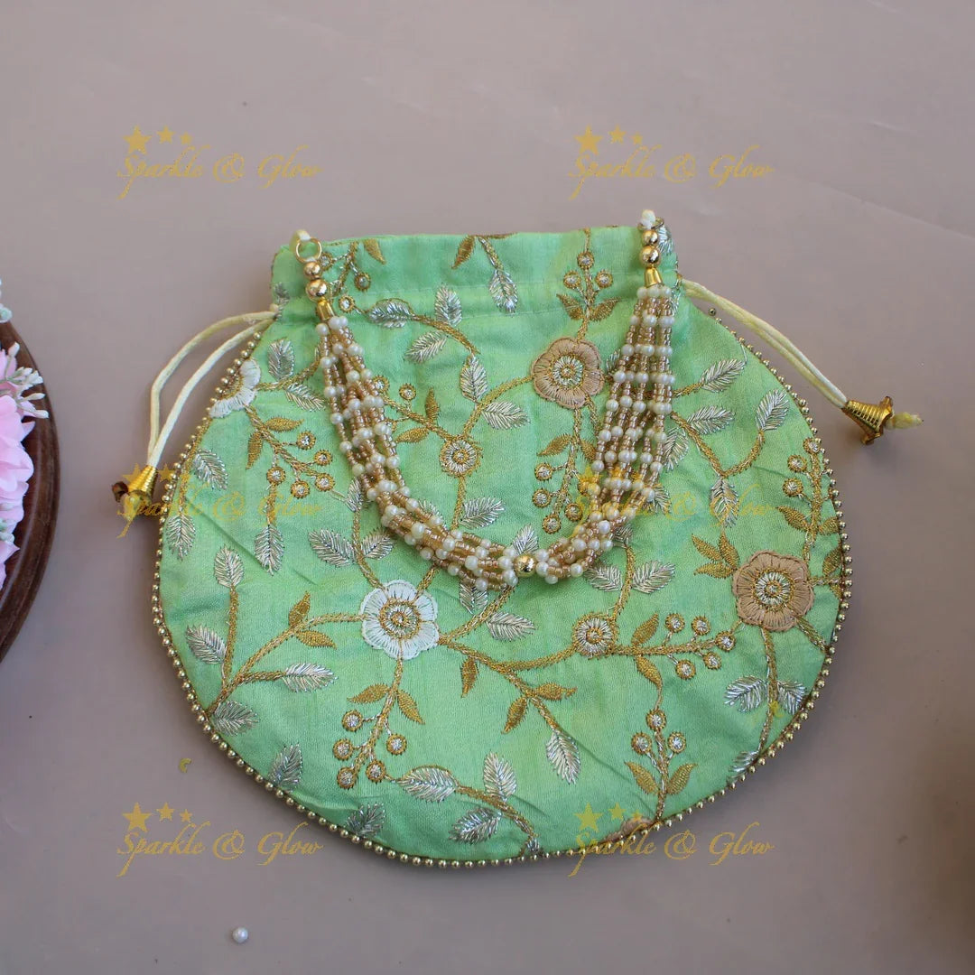 Floral Embroidered pot shape 8.5*8 inch potli bags with gold beads and pearl handle - Sparkle and Glow