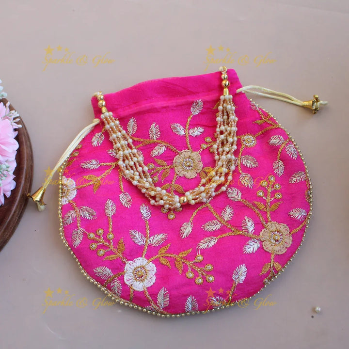 Floral Embroidered pot shape 8.5*8 inch potli bags with gold beads and pearl handle - Sparkle and Glow