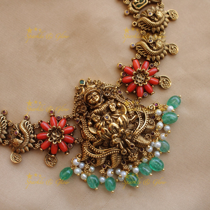 Statement Lakshmi peacock carved short necklace with coral and mint green beads