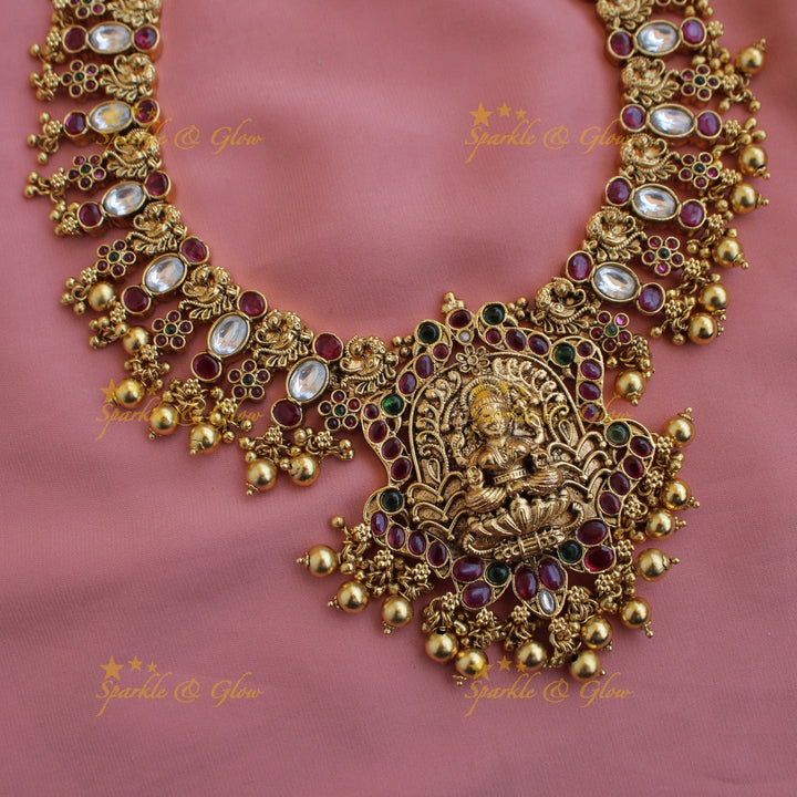 Grand intricate Lakshmi peacock carved kemp stone long necklace with gold beads