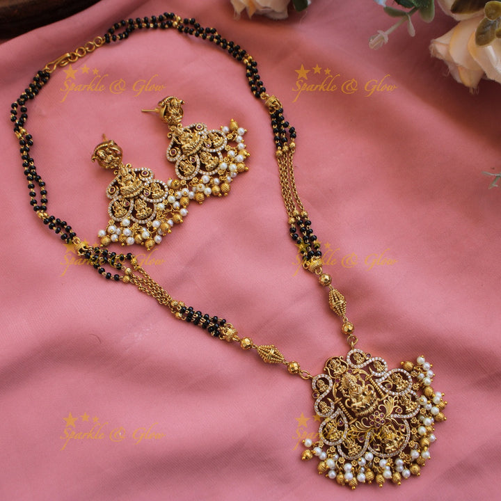 Exclusive Lakshmi carved pendant multi black beads necklace with CZ stones and pearls
