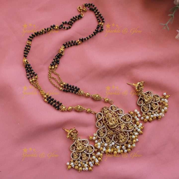Exclusive Lakshmi carved pendant multi black beads necklace with CZ stones and pearls