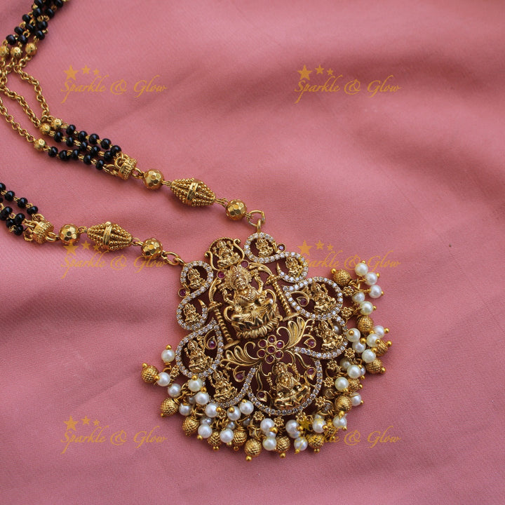 Exclusive Lakshmi carved pendant multi black beads necklace with CZ stones and pearls
