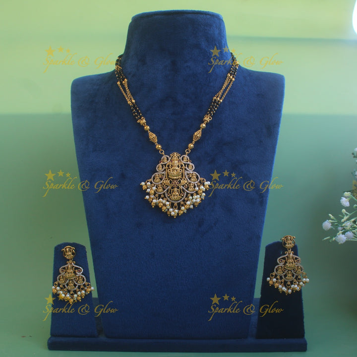 Exclusive Lakshmi carved pendant multi black beads necklace with CZ stones and pearls