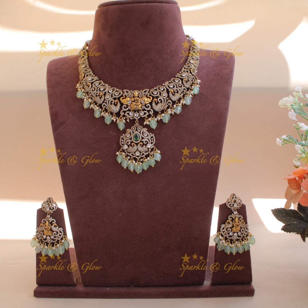 Elegant Lakshmi elephant peacock design dual tone victorian AD short necklace withmint green beads
