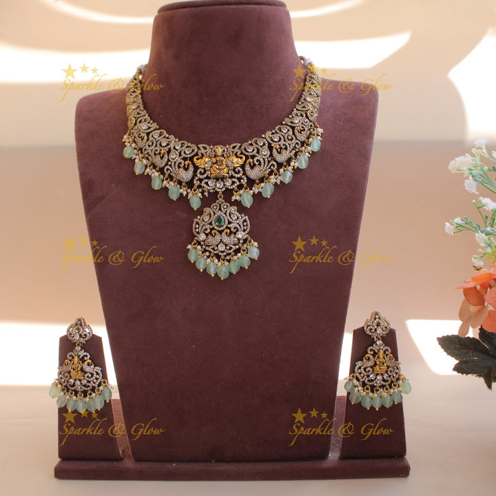 Elegant Lakshmi elephant peacock design dual tone victorian AD short necklace withmint green beads
