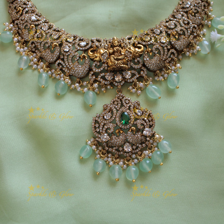 Elegant Lakshmi elephant peacock design dual tone victorian AD short necklace withmint green beads