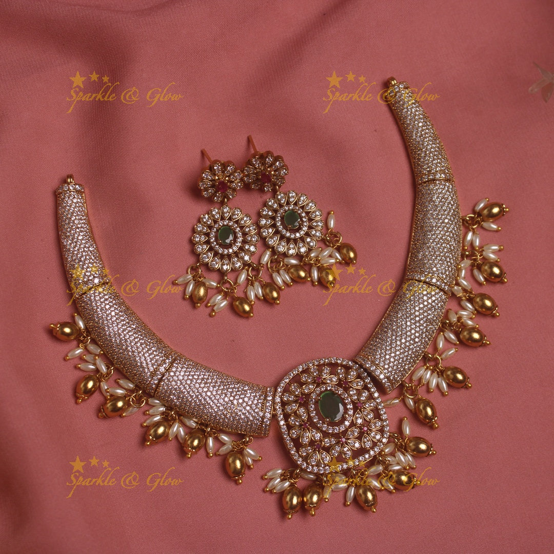 Gorgeous Tribal and floral design AD short necklace with emeralds rice pearls and gold beads