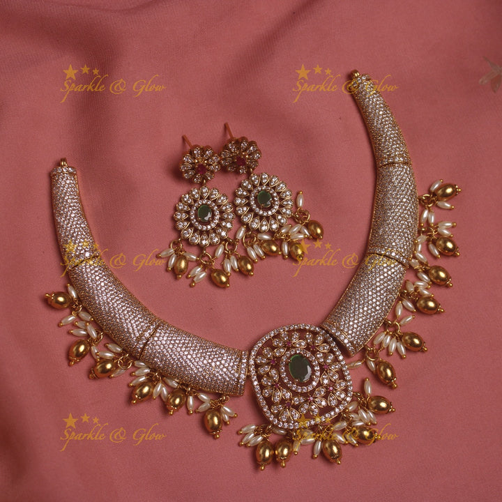 Gorgeous Tribal and floral design AD short necklace with emeralds rice pearls and gold beads