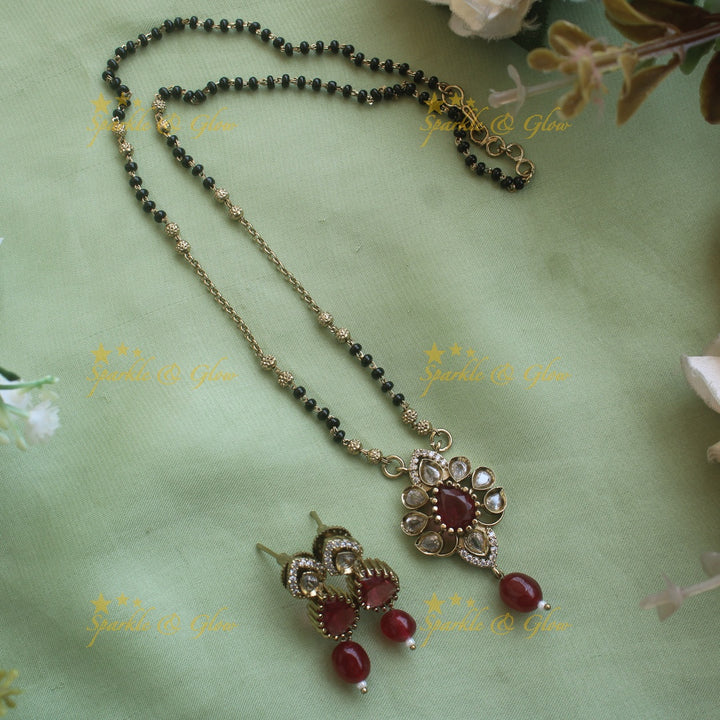 Beautiful Floral design pendant black beads necklace, mangalsutra with Maroon green stones and beads