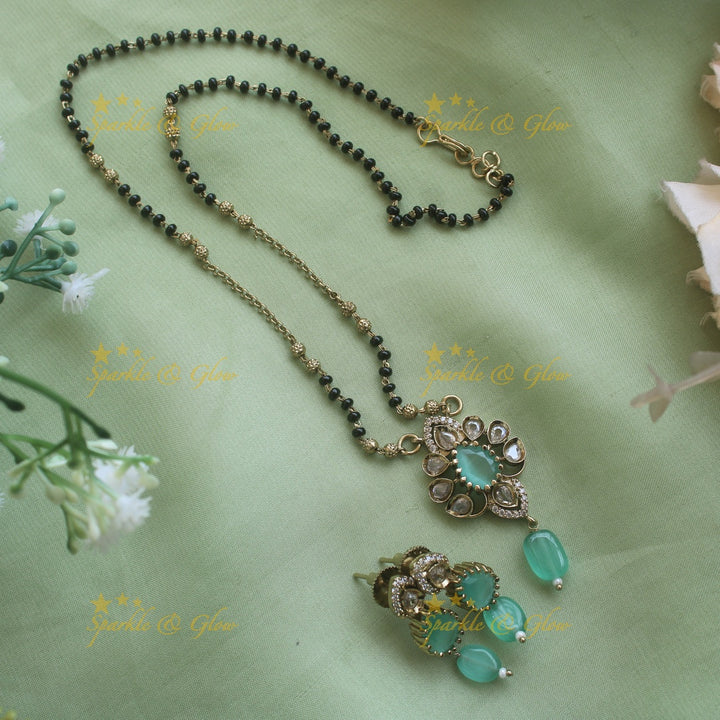Beautiful Floral design pendant black beads necklace, mangalsutra with mint green beads and stones