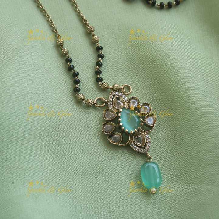 Beautiful Floral design pendant black beads necklace, mangalsutra with mint green beads and stones
