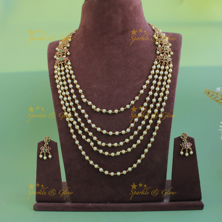 Grand Lotus design multi layer pearl haram with ruby and emerald stones