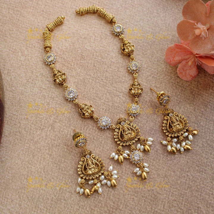 Beautiful Lakshmi floral short necklace with ruby emerald white stones and rice pearls - Multi - Sparkle and Glow