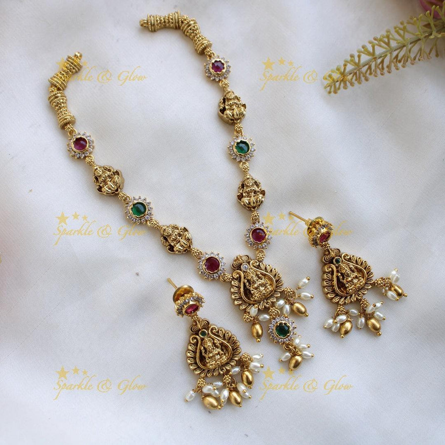 Beautiful Lakshmi floral short necklace with ruby emerald white stones and rice pearls - Multi - Sparkle and Glow