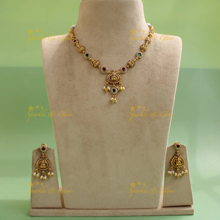 Beautiful Lakshmi floral short necklace with ruby emerald white stones and rice pearls - Multi - Sparkle and Glow