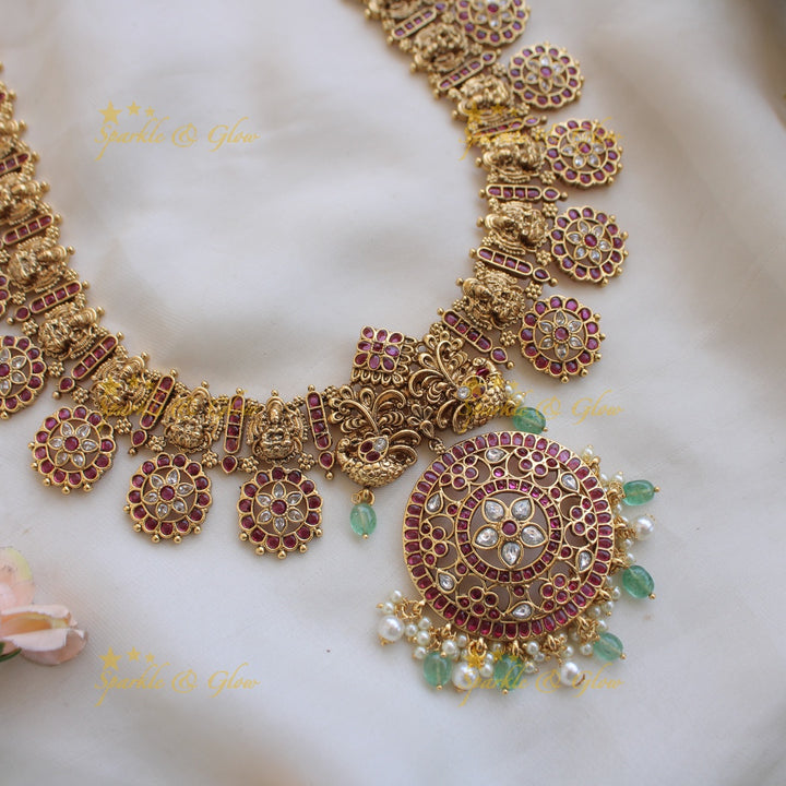 Gorgeous Lakshmi peacock carved floral design bottu long necklace with kemp stones and mint green beads