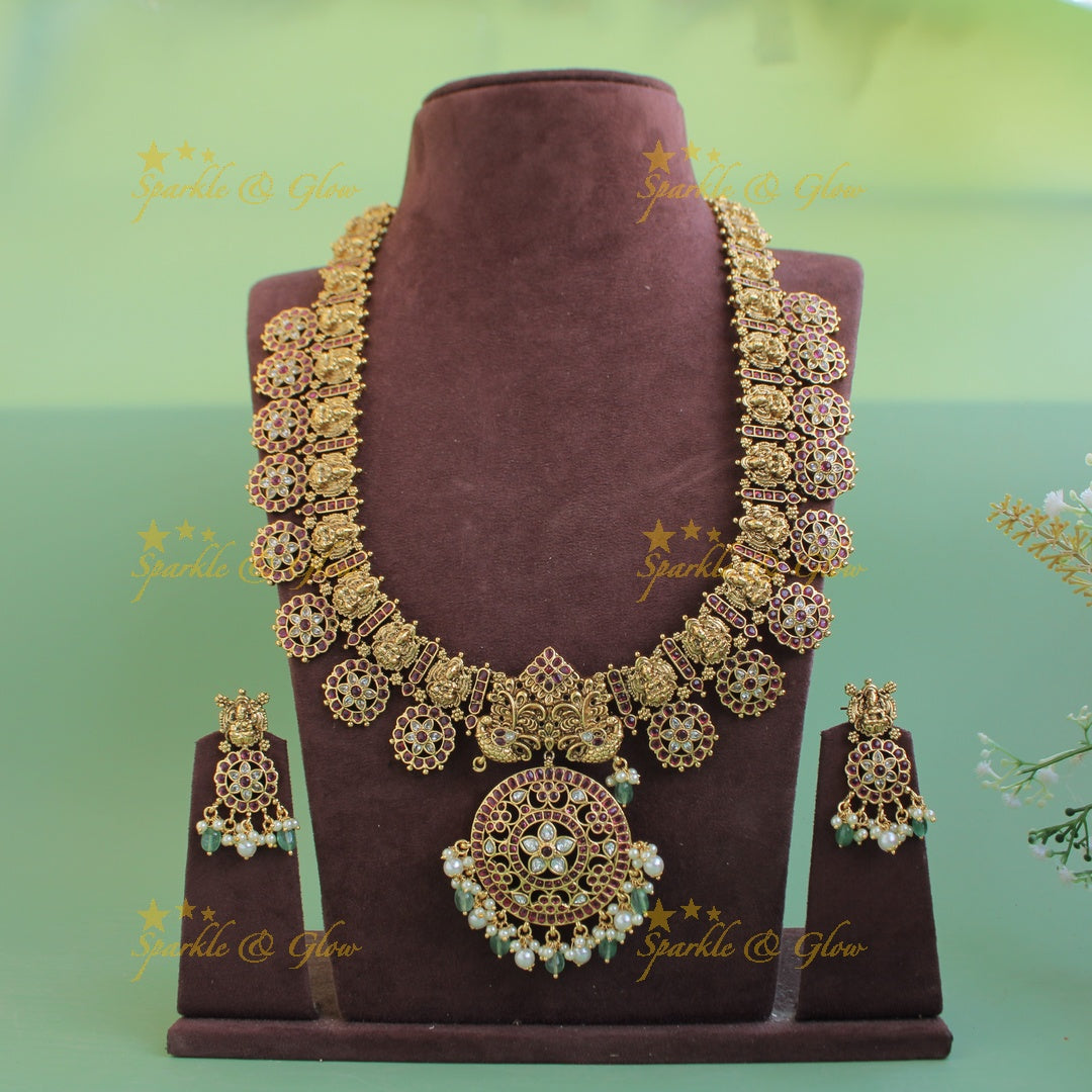 Gorgeous Lakshmi peacock carved floral design bottu long necklace with kemp stones and mint green beads