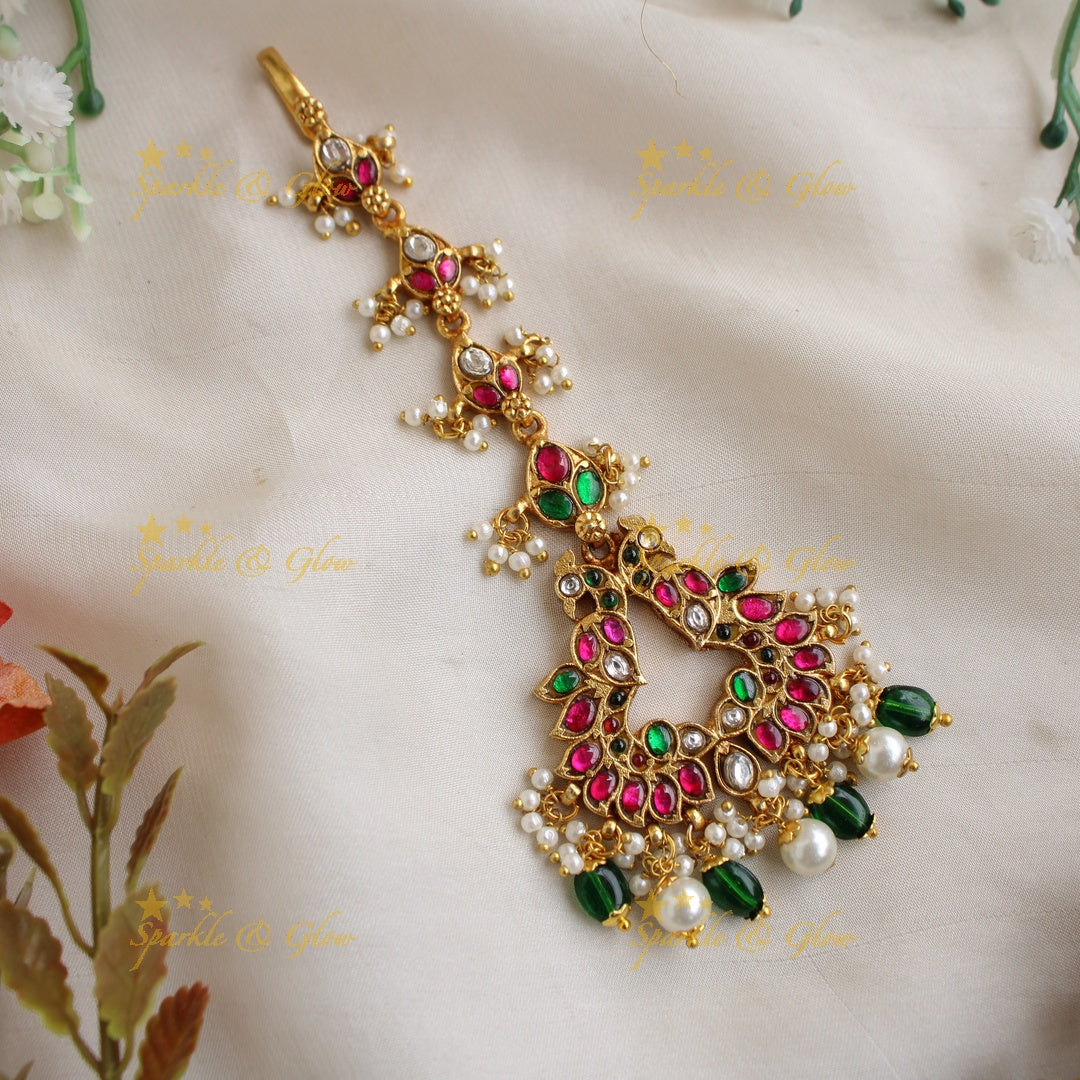 Intricately Carved Jadau Peacock Floral Tikka with Green and pearl beads