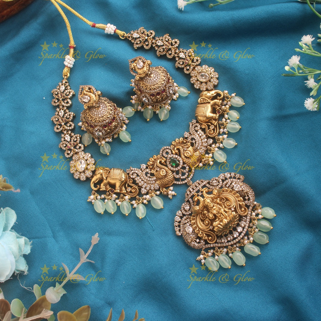 Elegant Lakshmi elephant and peacock carved dual tone Victorian AD short necklace with mint green beads
