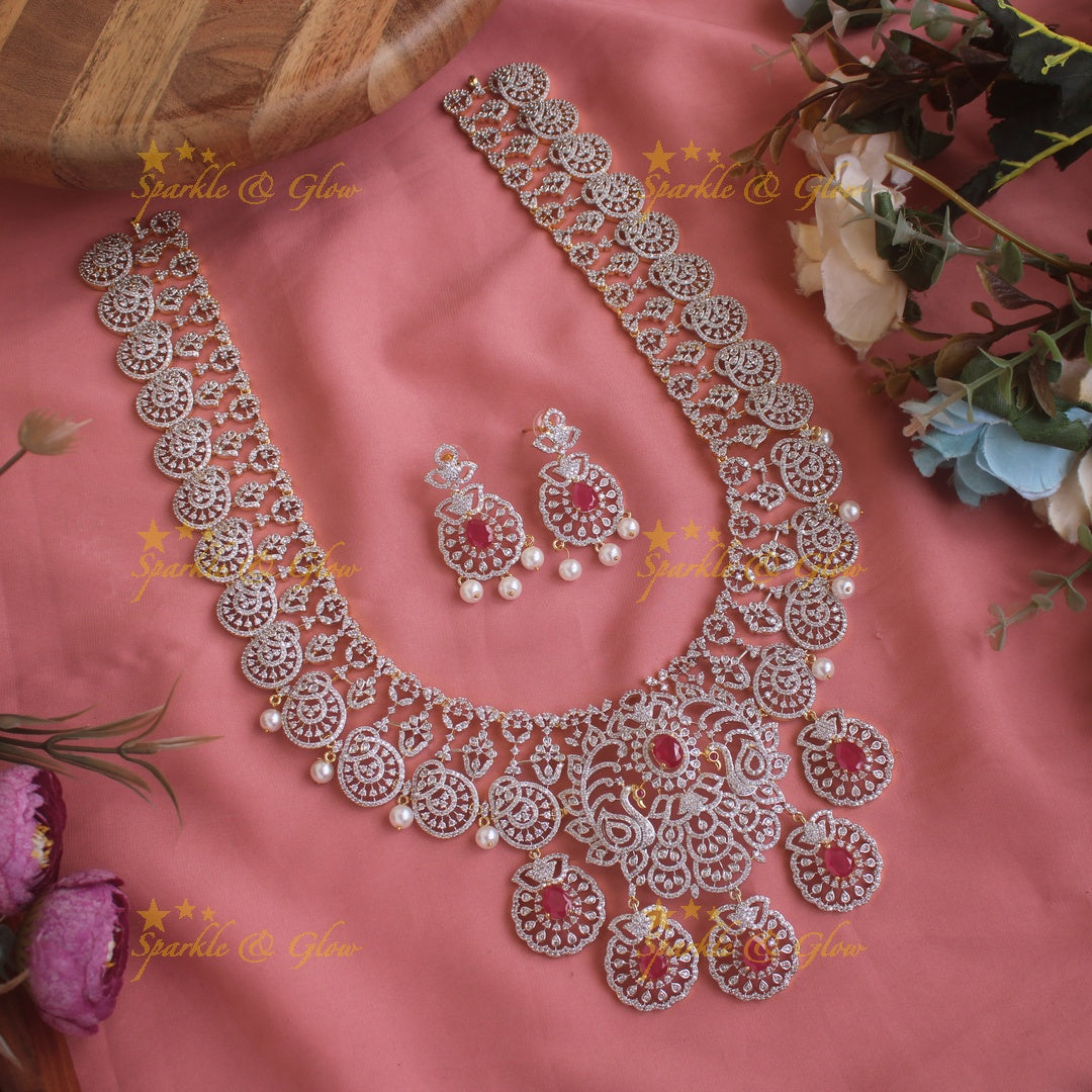 Sparkling Peacock Floral design American diamond long necklace with emerald and pearls - green