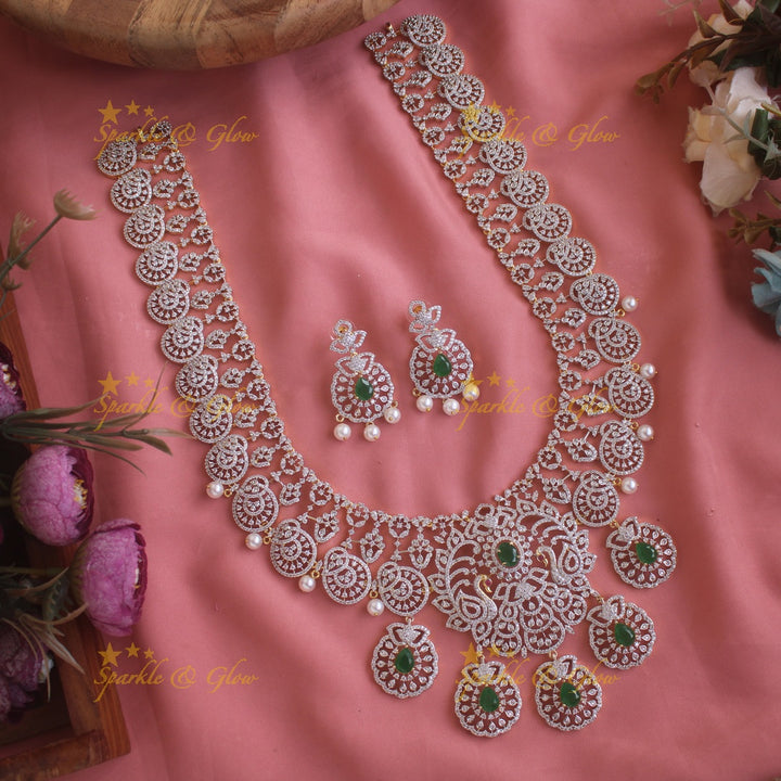 Sparkling Peacock Floral design American diamond long necklace with emerald and pearls - green