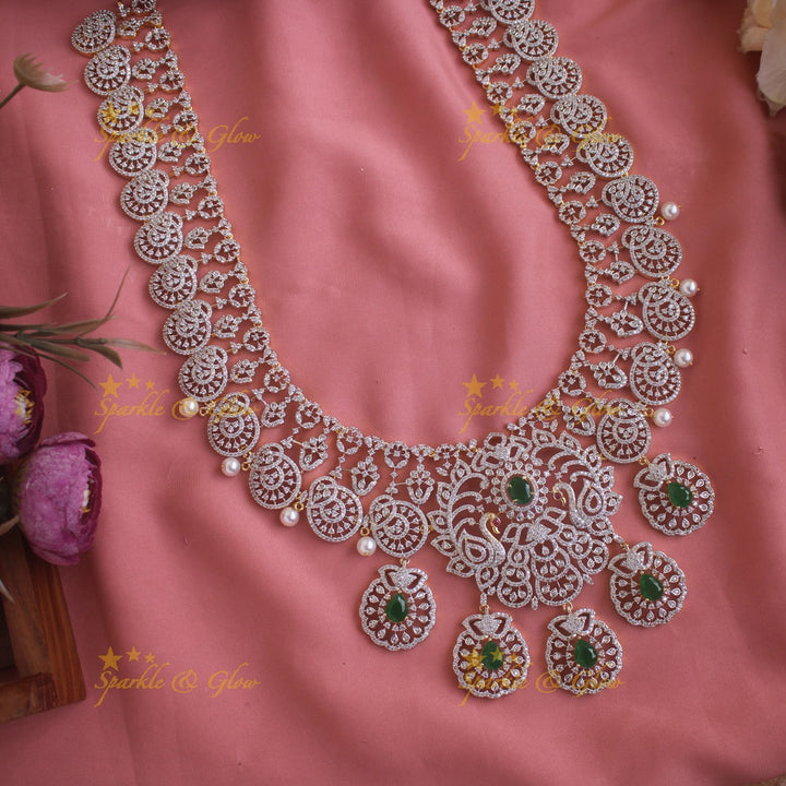 Sparkling Peacock Floral design American diamond long necklace with emerald and pearls - green
