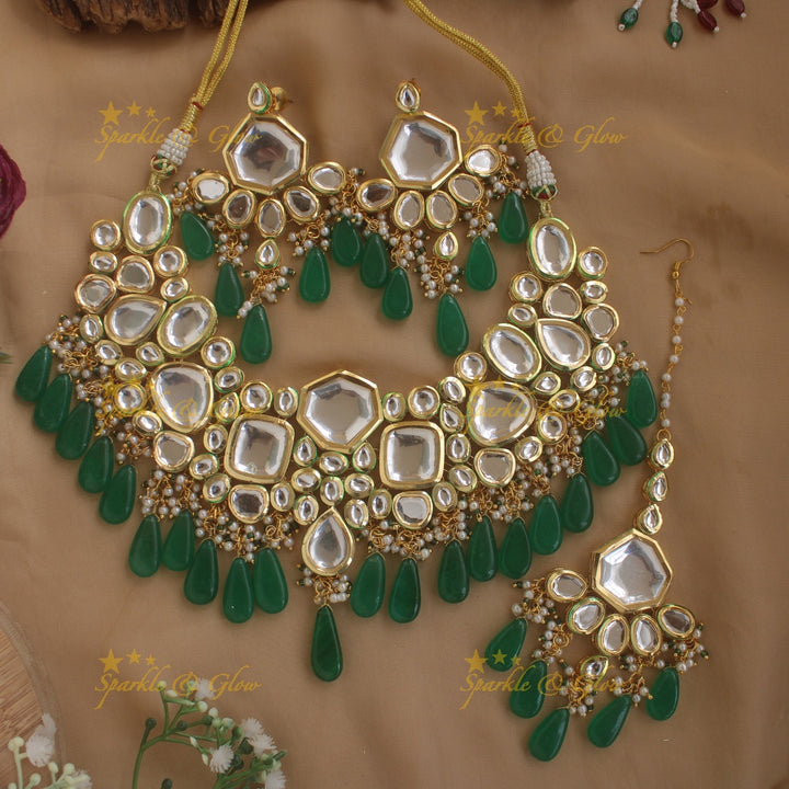 Grand Kundan Stone Bridal short necklace with pearls and green beads with maang tikka