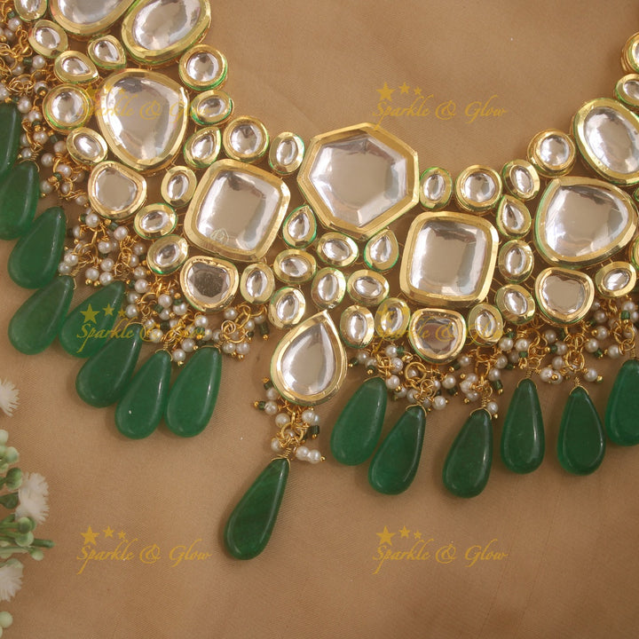 Grand Kundan Stone Bridal short necklace with pearls and green beads with maang tikka