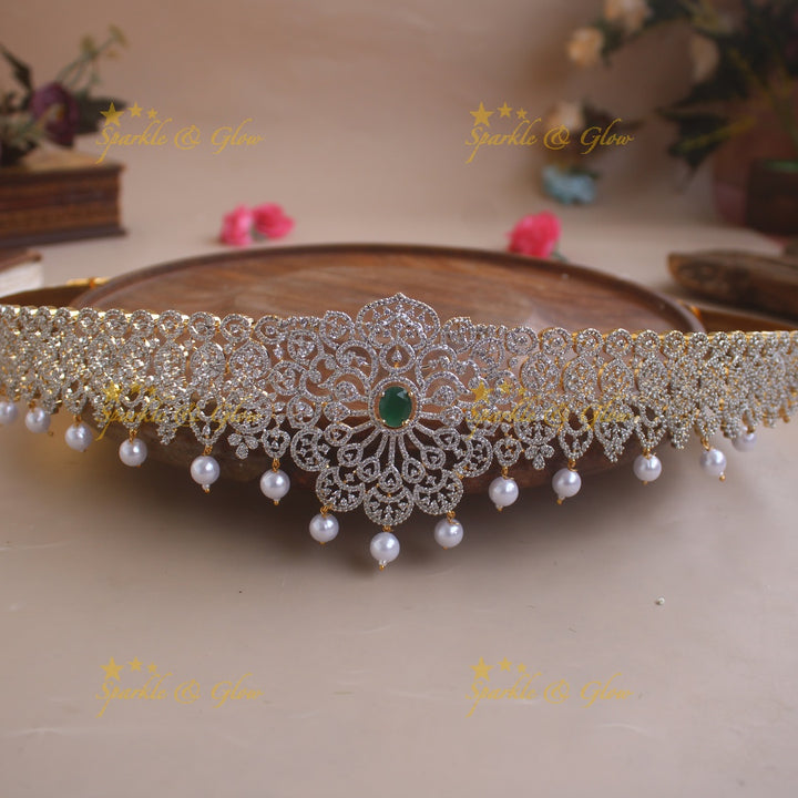 Sparkling Floral design American diamond hipbelt with emerald in centre and pearl drops
