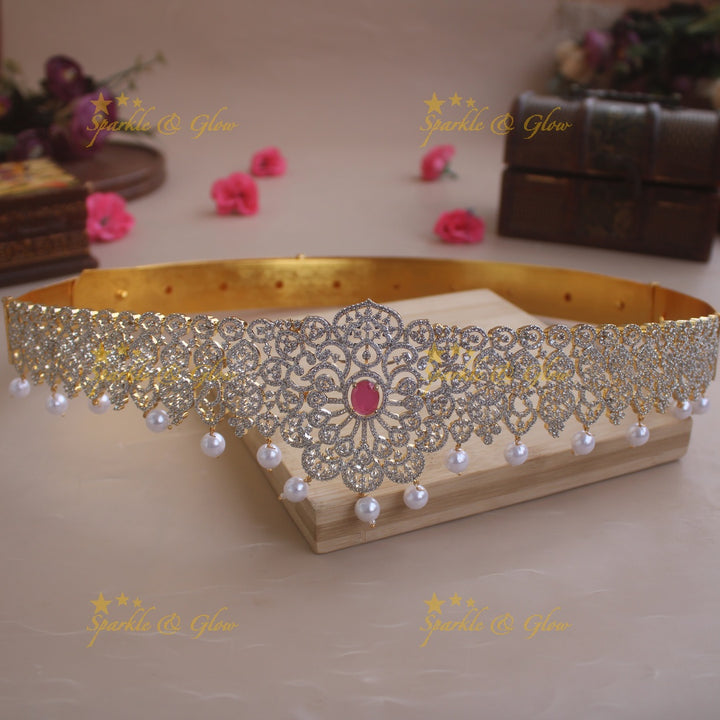 Sparkling Floral design American diamond hipbelt with emerald in centre and pearl drops